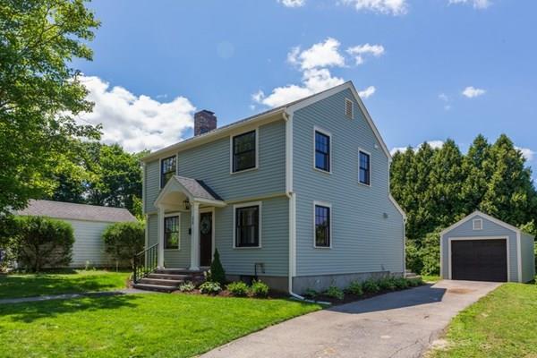 25 Magnolia Road Milton, MA 02186 - Photo 2 of 28 a front view of a house with a yard and a garden