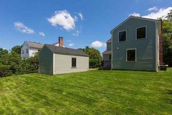 25 Magnolia Road Milton, MA 02186 - Photo 28 of 28 a house view with a garden space
