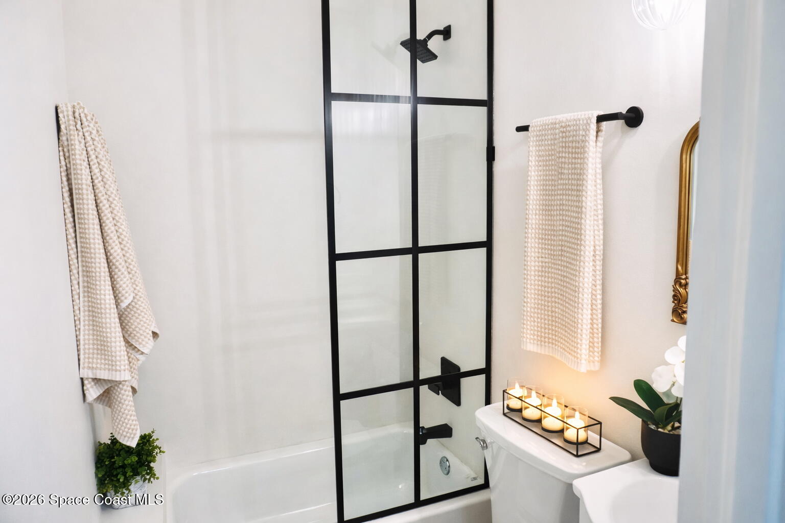 804 Oak Street Melbourne Beach, FL 32951 - Photo 12 of 51 a white bath tub sitting next to a shower