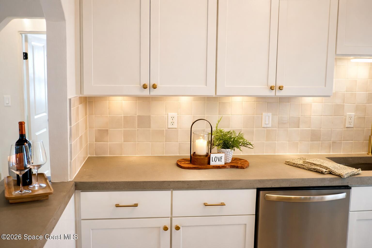 804 Oak Street Melbourne Beach, FL 32951 - Photo 22 of 51 a kitchen with a sink and cabinets