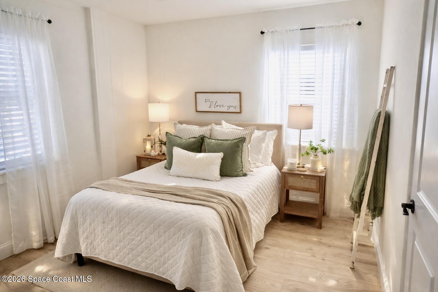 804 Oak Street Melbourne Beach, FL 32951 - Photo 27 of 51 a bedroom with a bed and a window