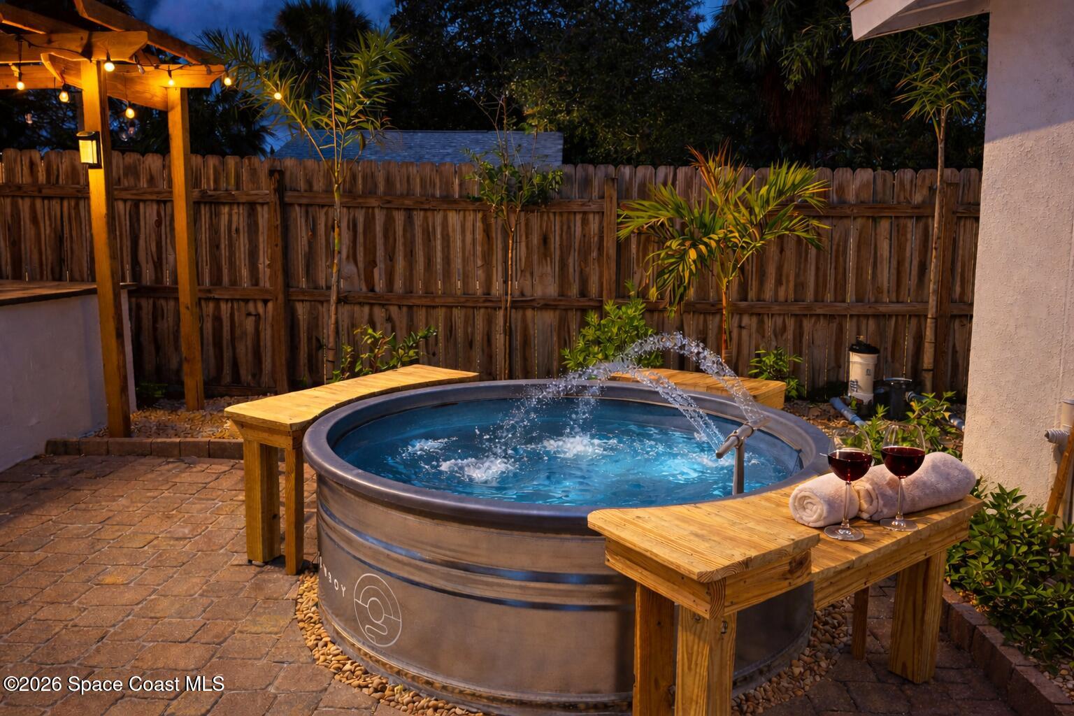 804 Oak Street Melbourne Beach, FL 32951 - Photo 3 of 51 a backyard of a house with table and chairs