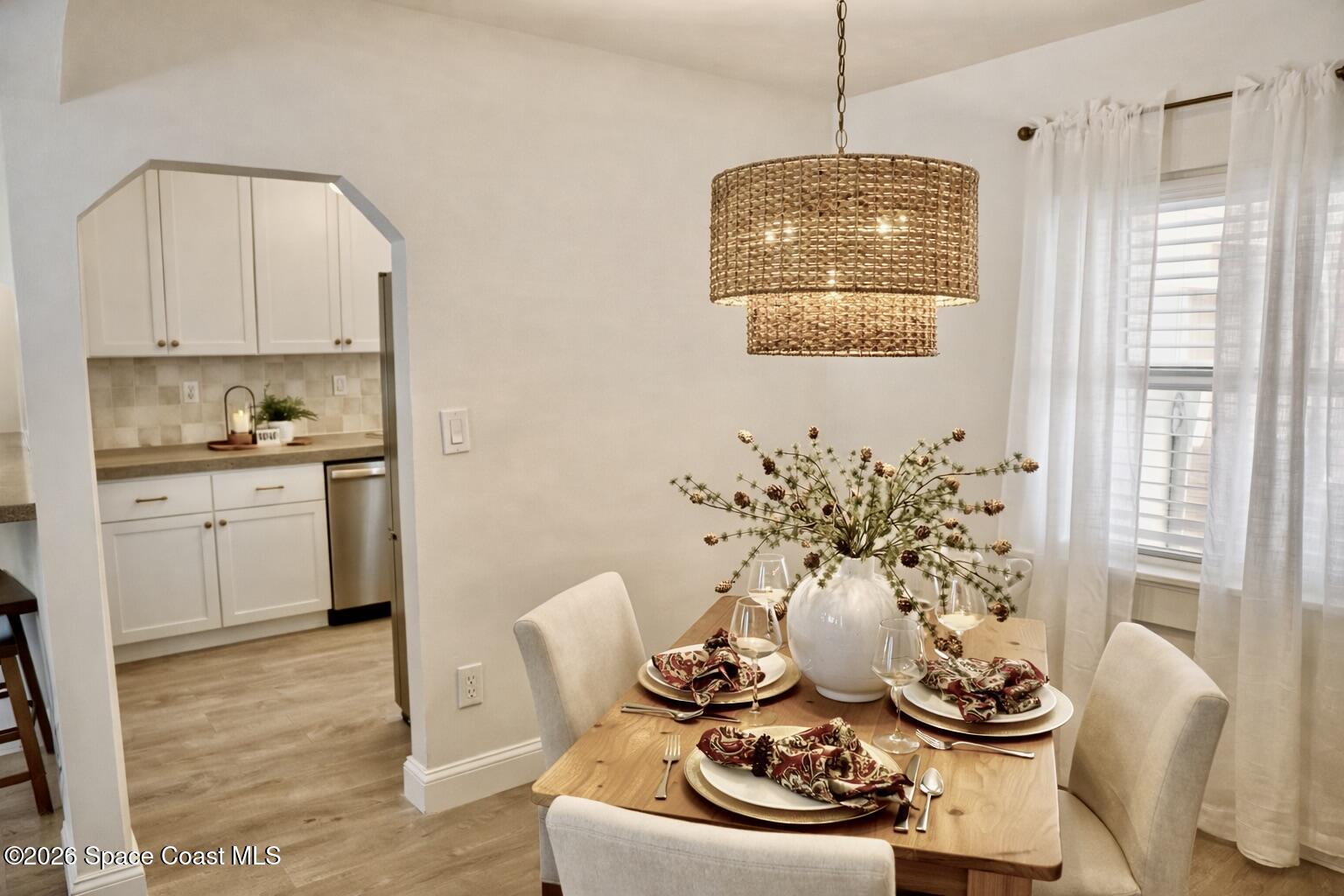 804 Oak Street Melbourne Beach, FL 32951 - Photo 35 of 51 a dining room with furniture and window