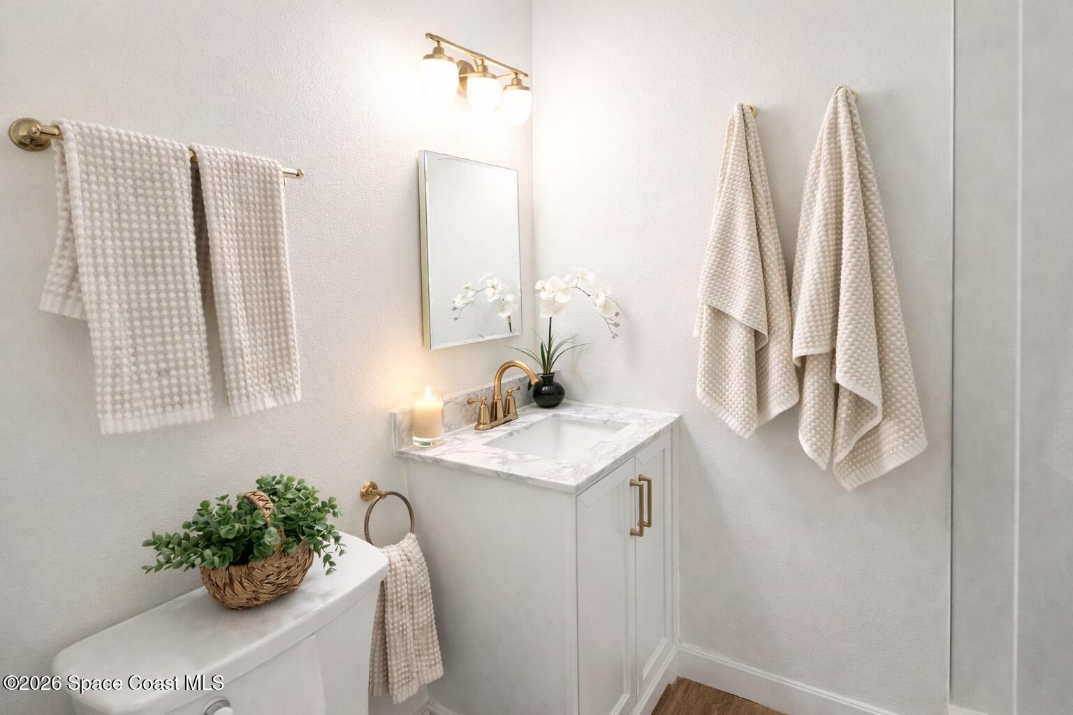 804 Oak Street Melbourne Beach, FL 32951 - Photo 41 of 51 a bathroom with a sink a mirror and a window