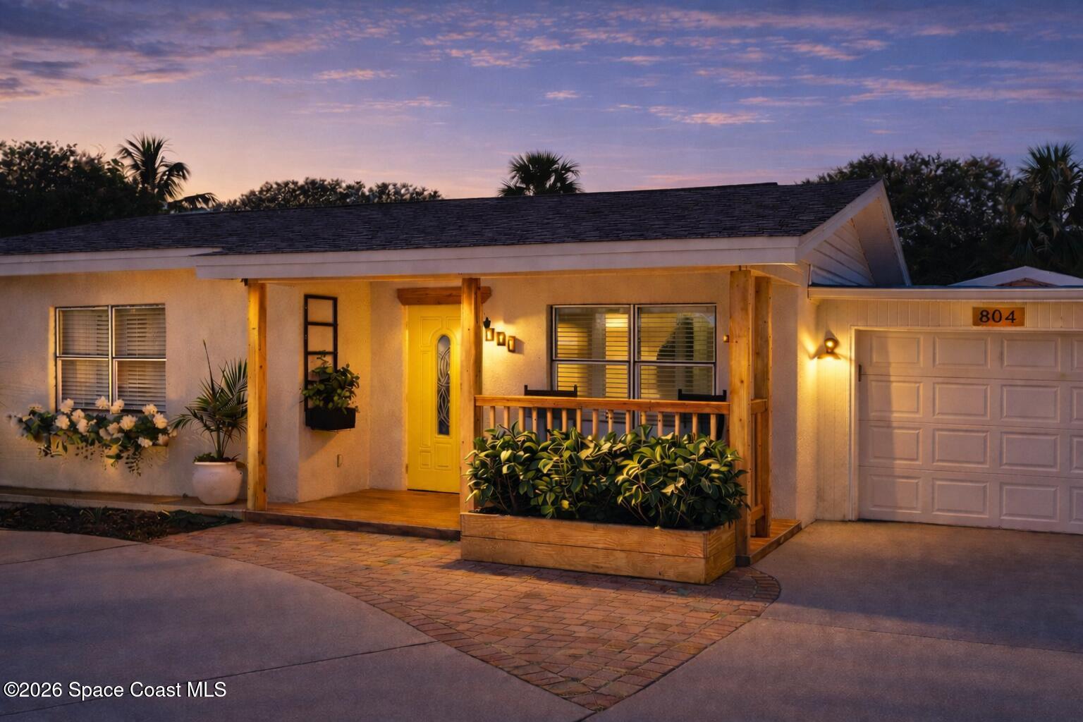 804 Oak Street Melbourne Beach, FL 32951 - Photo 51 of 51 a view of front door and potted plants