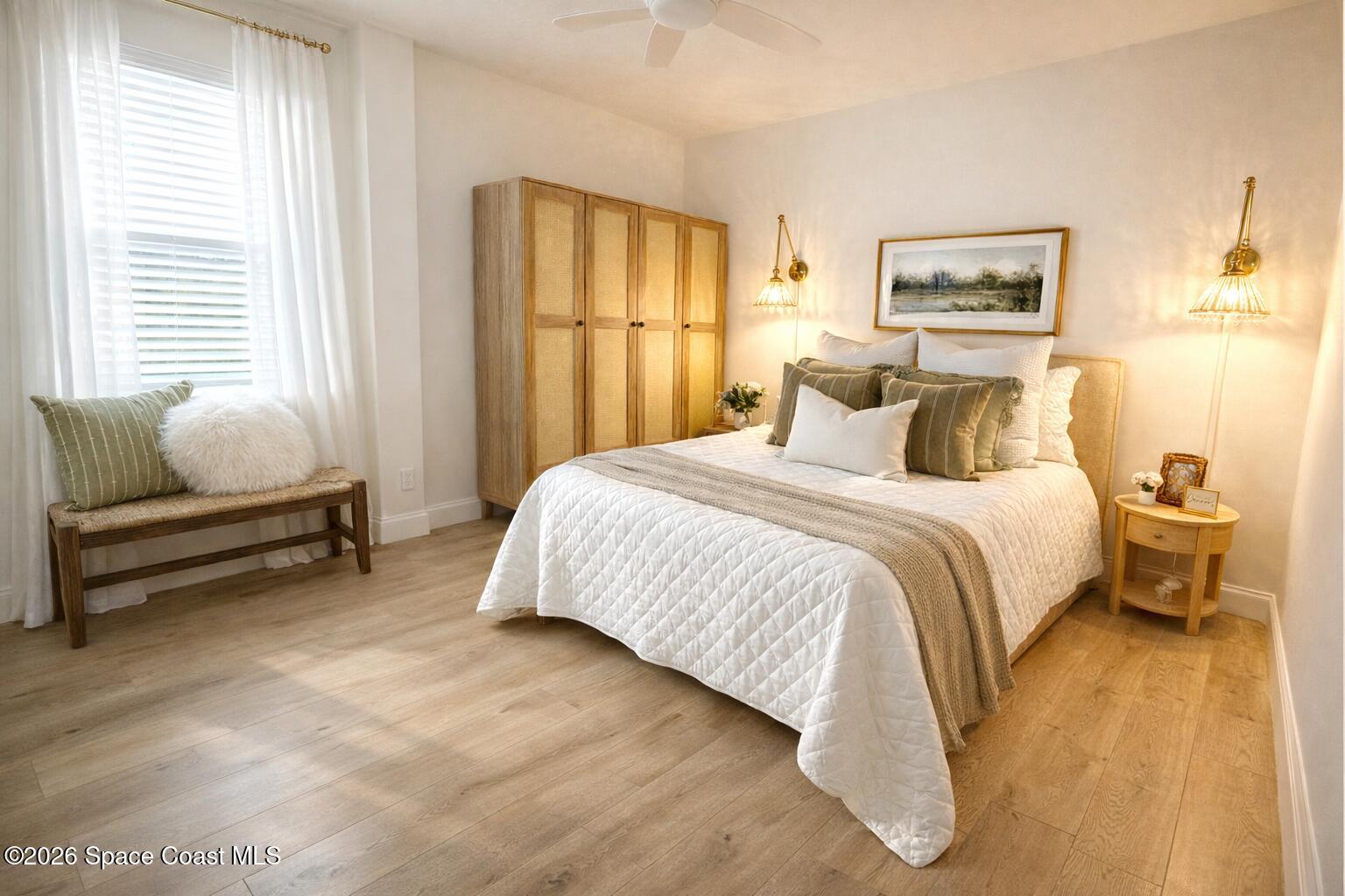 804 Oak Street Melbourne Beach, FL 32951 - Photo 9 of 51 a bedroom with a bed and a couch