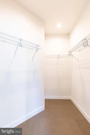 a bathroom with a sink a toilet a shower and a mirror