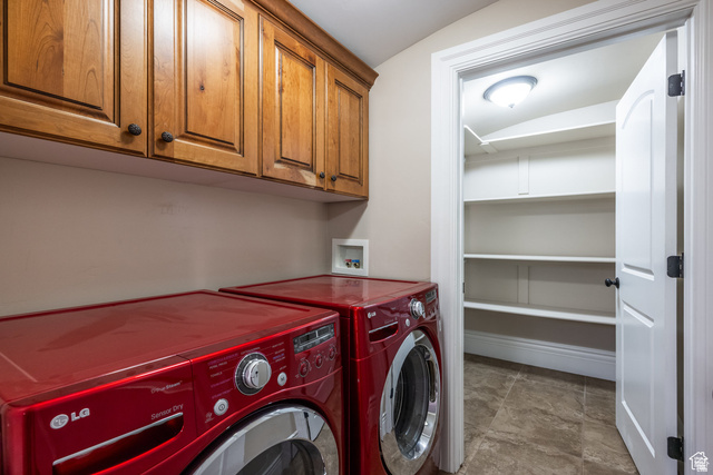 694 West Cephus Road Draper, UT 84020 - Photo 122 of 148 Utility room with wood-finish upper cabinetry and a tiled floor