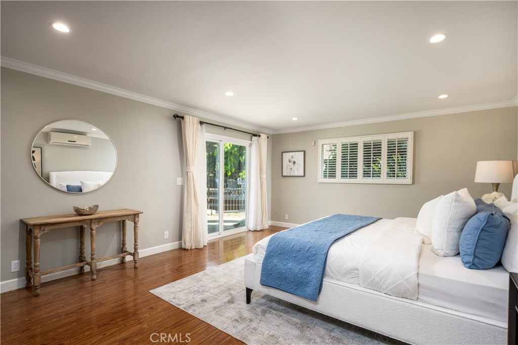 452 West Winnie Way Arcadia, CA 91007 - Photo 12 of 25 a bedroom with a bed a mirror on desk and a window