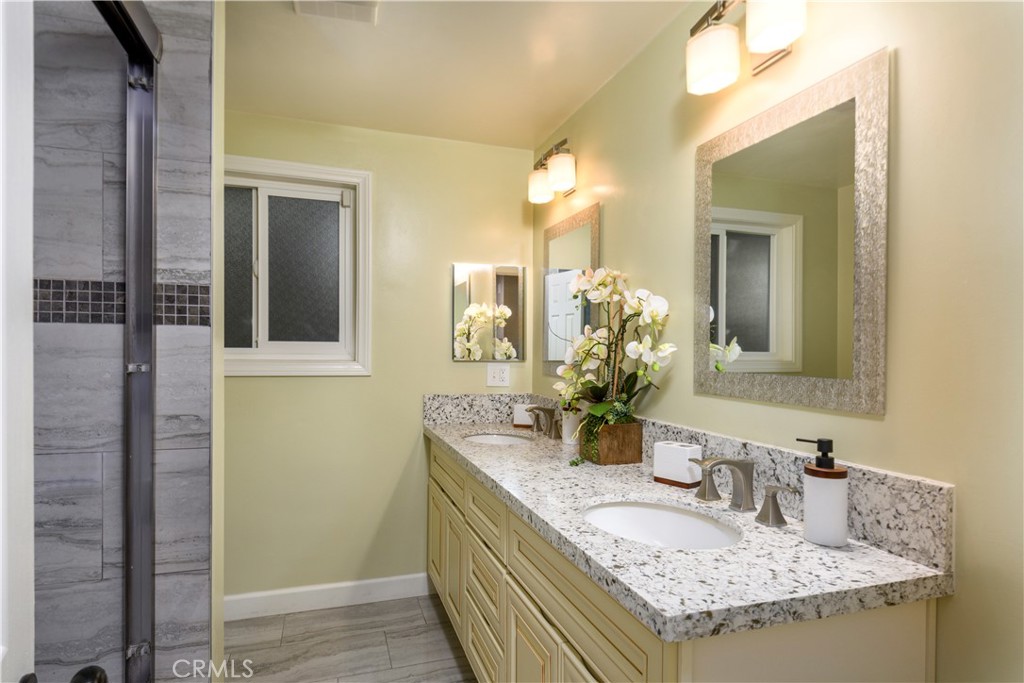 452 West Winnie Way Arcadia, CA 91007 - Photo 18 of 25 a bathroom with sinks granite countertop a sink and a mirror