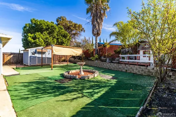 a aerial view of a house with swimming pool garden and patio