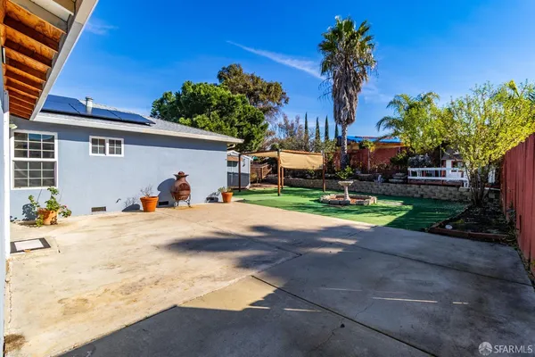 a view of a backyard with a car parked in it