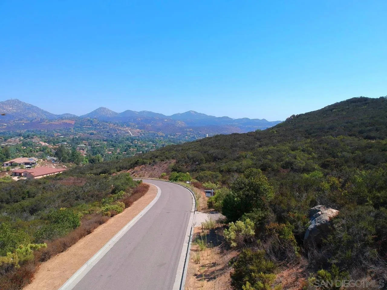 7 Del Poniente Road, Unit 7 Poway, CA 92064 - Photo 11 of 26 a view of a mountain with a street in the background