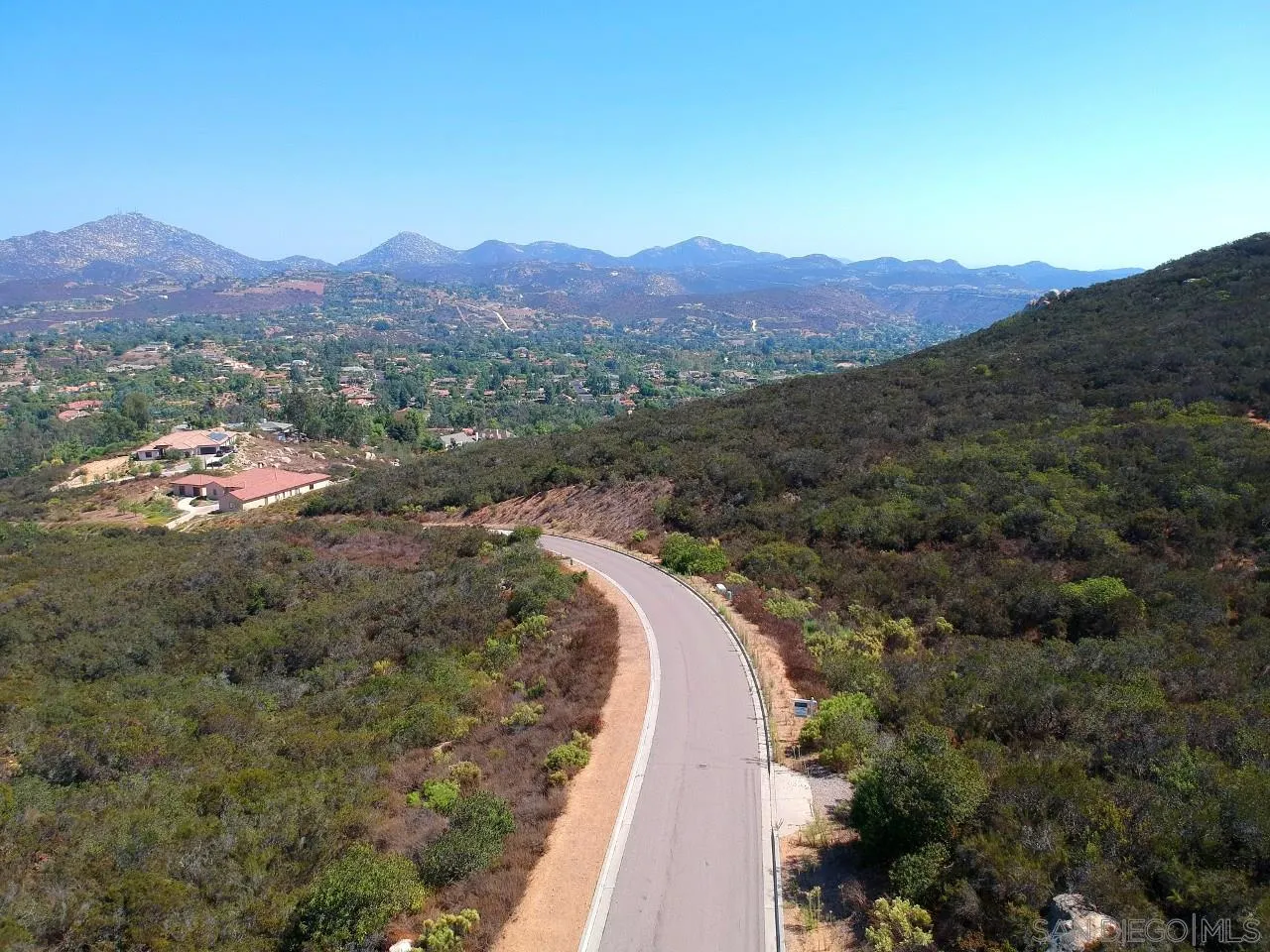 7 Del Poniente Road, Unit 7 Poway, CA 92064 - Photo 12 of 26 a view of a house with a mountain and a forest