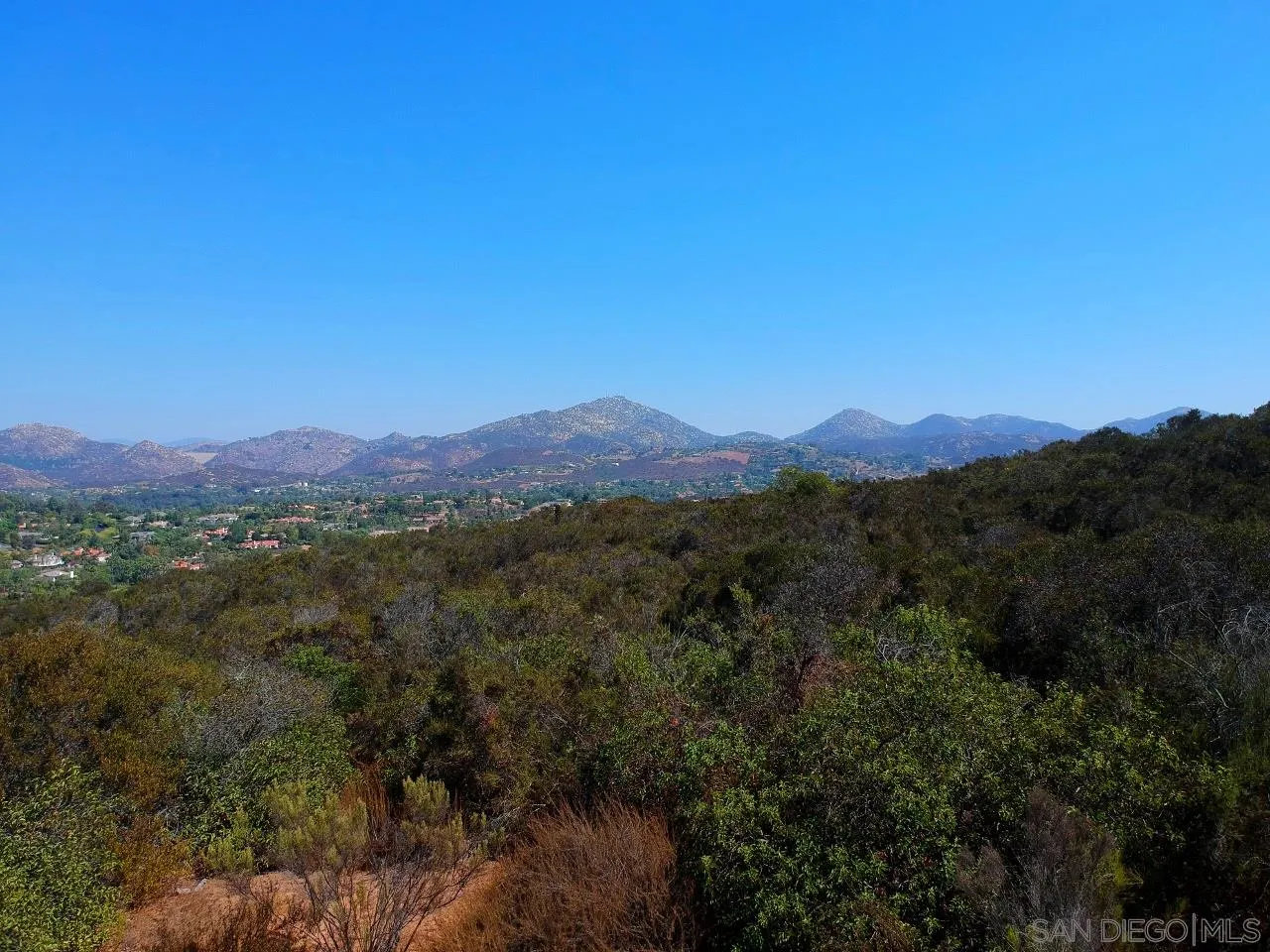 7 Del Poniente Road, Unit 7 Poway, CA 92064 - Photo 18 of 26 a view of a city with lush green forest