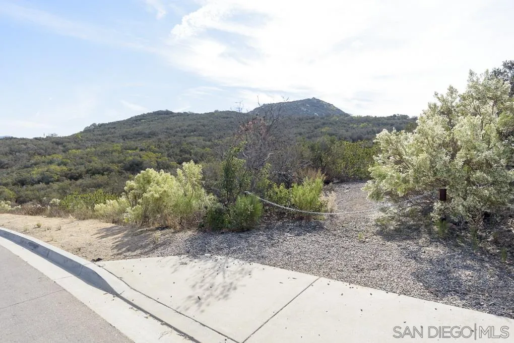 7 Del Poniente Road, Unit 7 Poway, CA 92064 - Photo 26 of 26 a view of a dry yard with mountains in the background