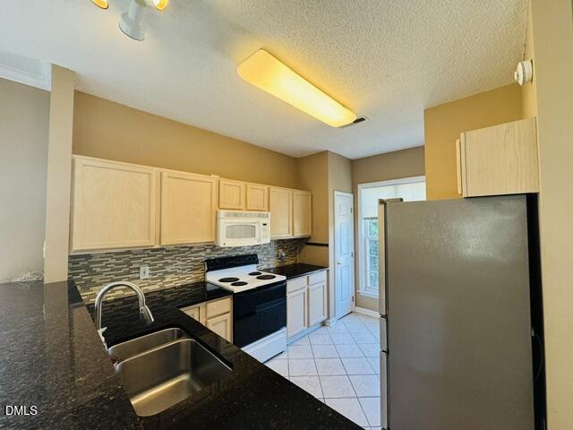 2027 Turtle Point Drive Raleigh, NC 27604 - Photo 4 of 18 a kitchen with stainless steel appliances granite countertop a refrigerator and a stove