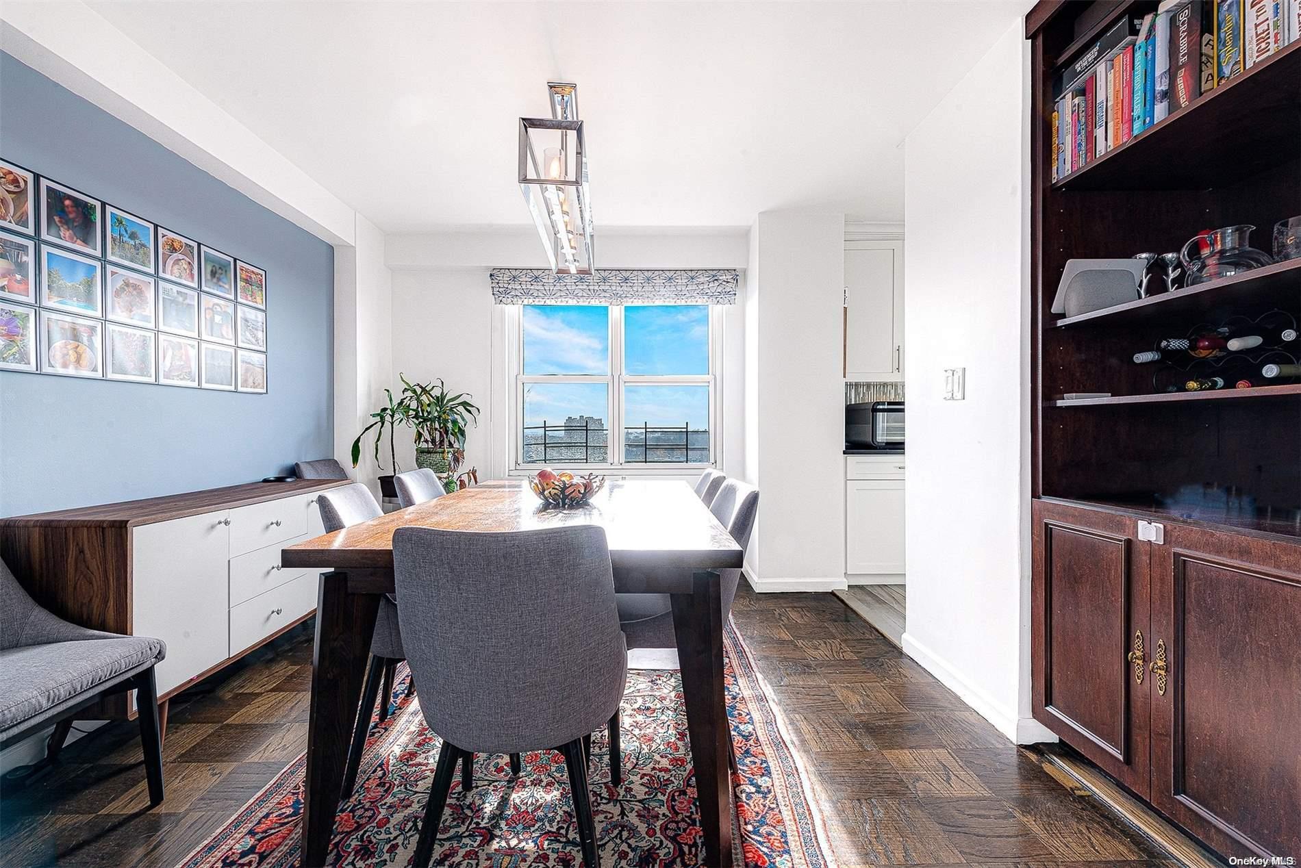 110-11 Queens Boulevard, Unit 20K Queens, NY 11375 - Photo 16 of 35 a view of a dining room with furniture window and wooden floor