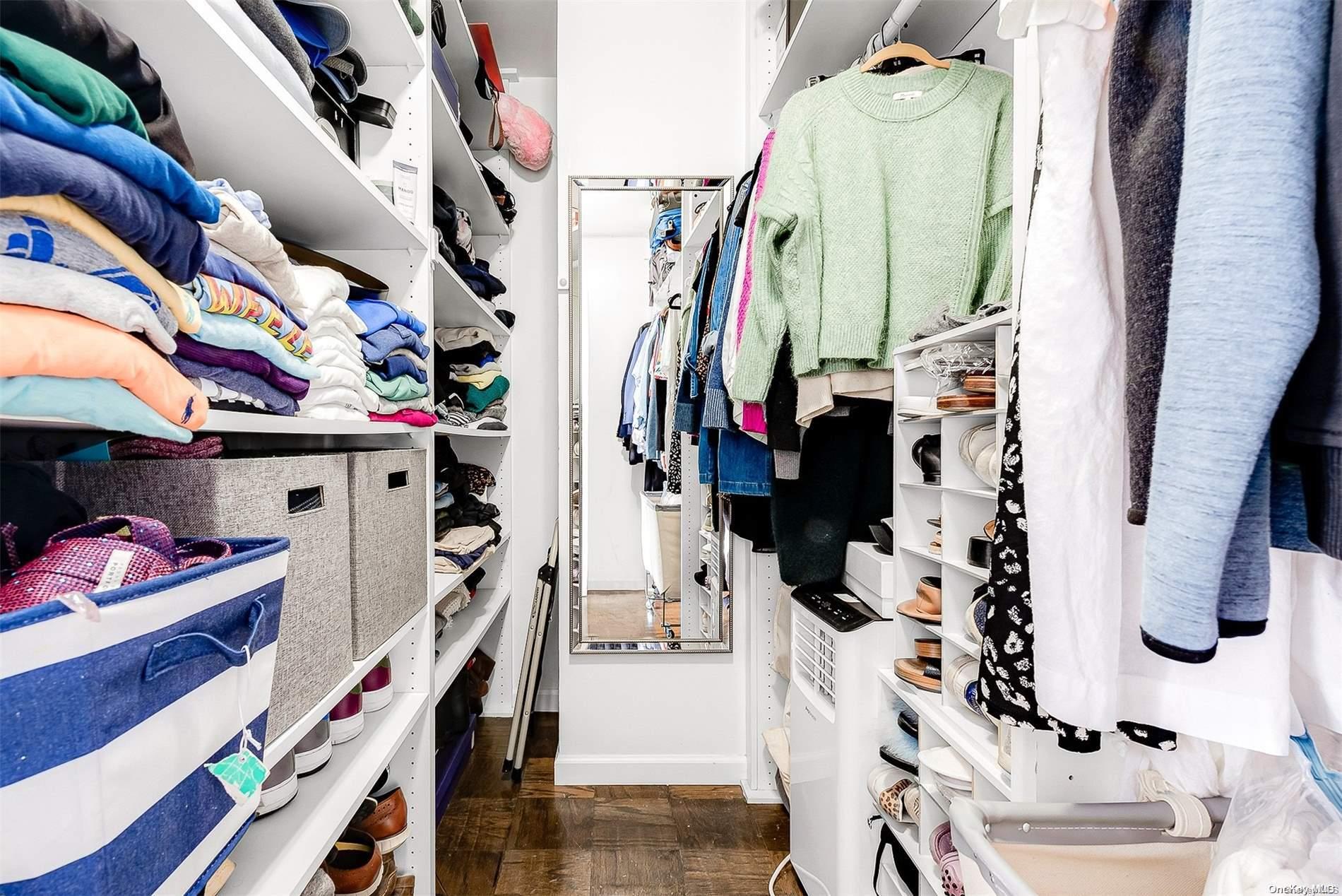 110-11 Queens Boulevard, Unit 20K Queens, NY 11375 - Photo 27 of 35 a view of walk in closet with clothes and shoes