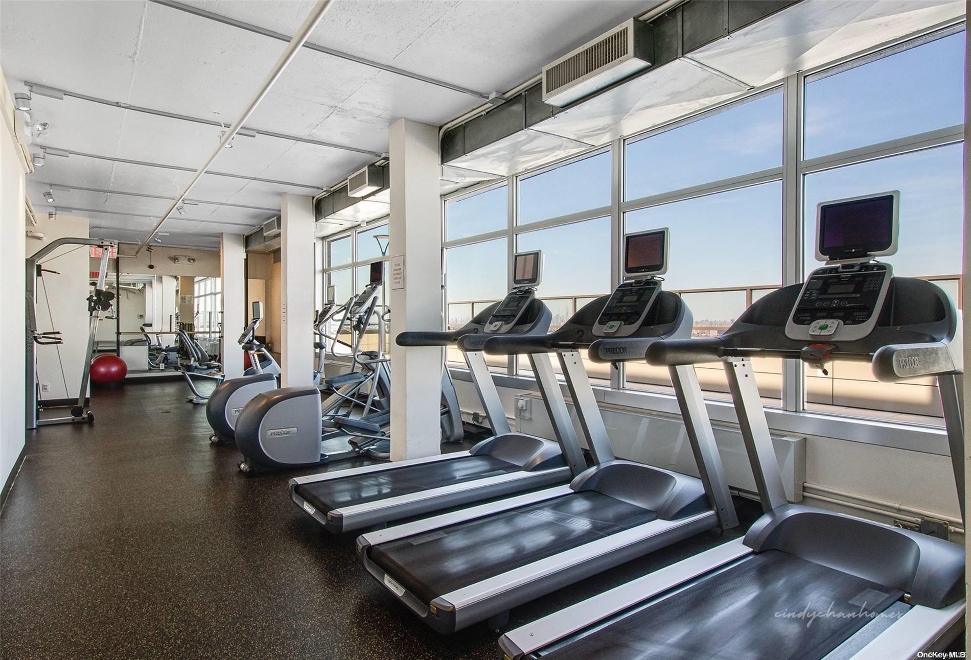110-11 Queens Boulevard, Unit 20K Queens, NY 11375 - Photo 29 of 35 a view of gym equipment and windows