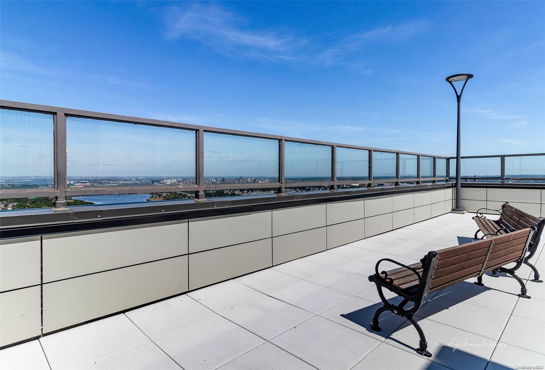 110-11 Queens Boulevard, Unit 20K Queens, NY 11375 - Photo 34 of 35 a room with a table chair and white walls