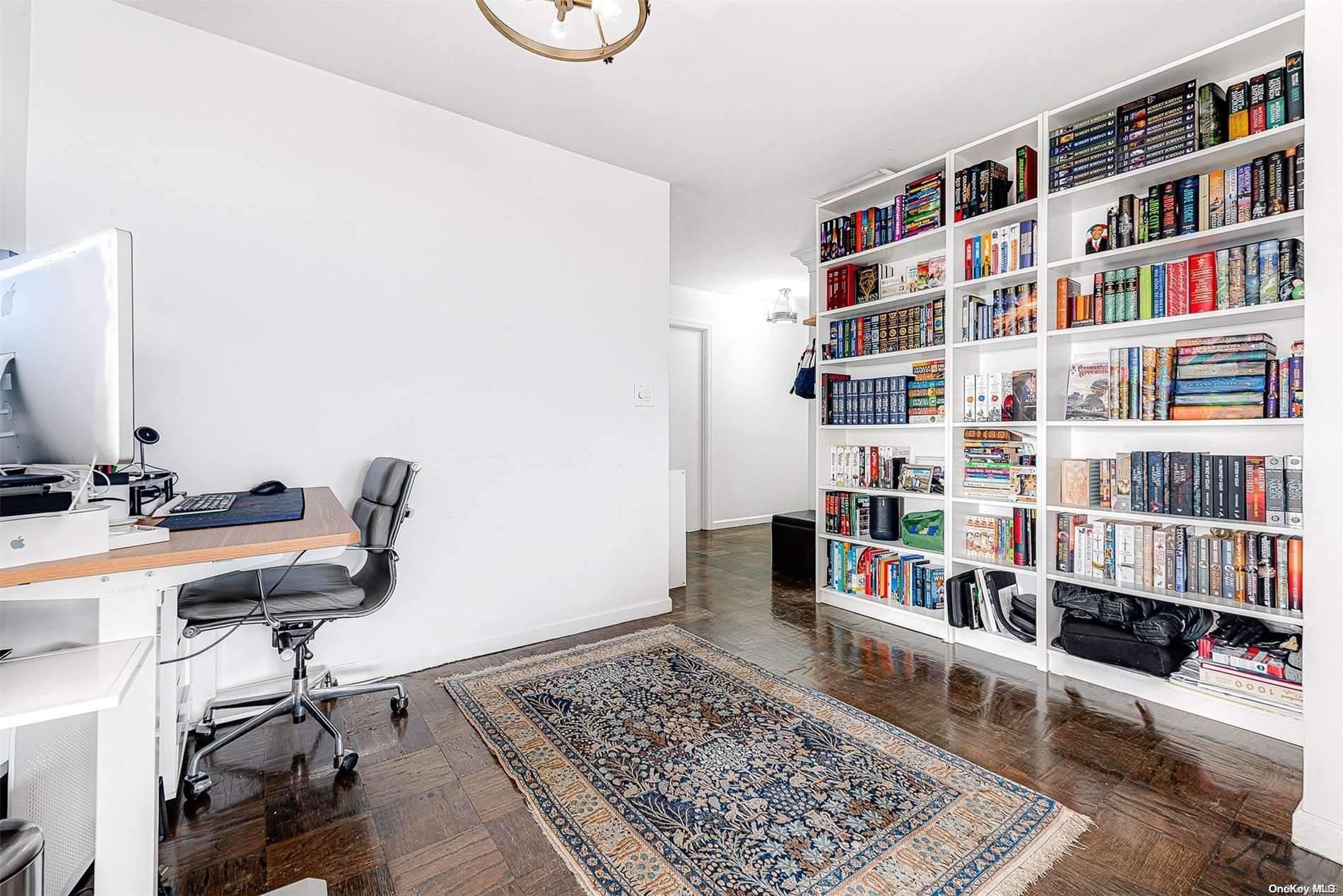 110-11 Queens Boulevard, Unit 20K Queens, NY 11375 - Photo 5 of 35 a view of a workspace with furniture and toys