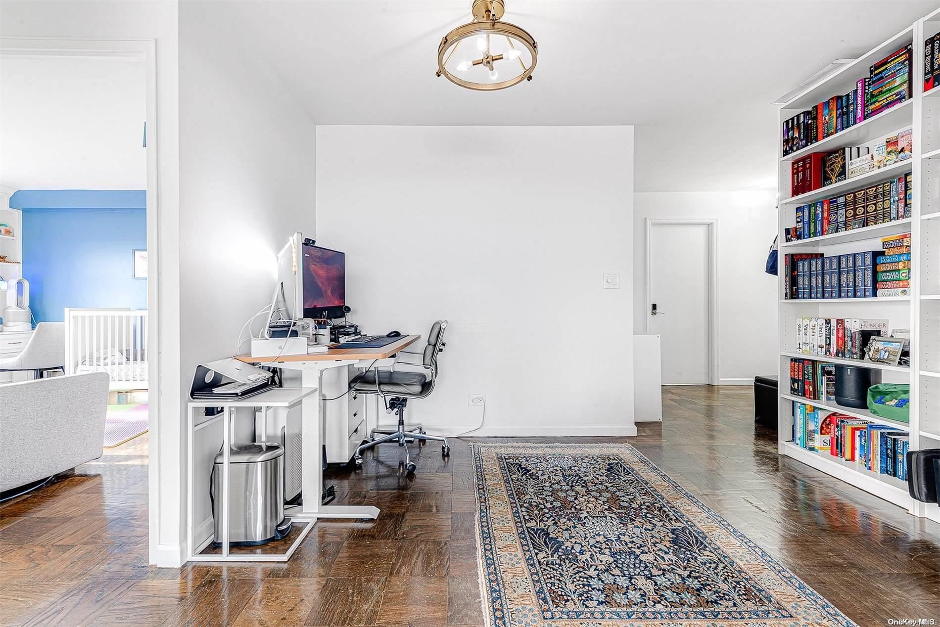 110-11 Queens Boulevard, Unit 20K Queens, NY 11375 - Photo 6 of 35 a view of a workspace with furniture and wooden floor