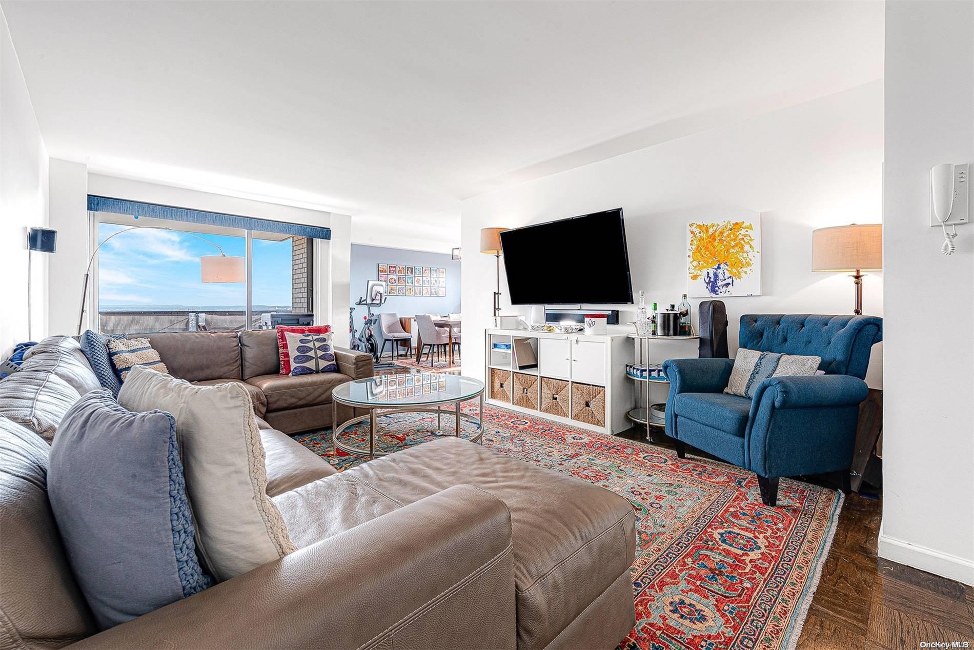 110-11 Queens Boulevard, Unit 20K Queens, NY 11375 - Photo 7 of 35 a living room with furniture and a flat screen tv