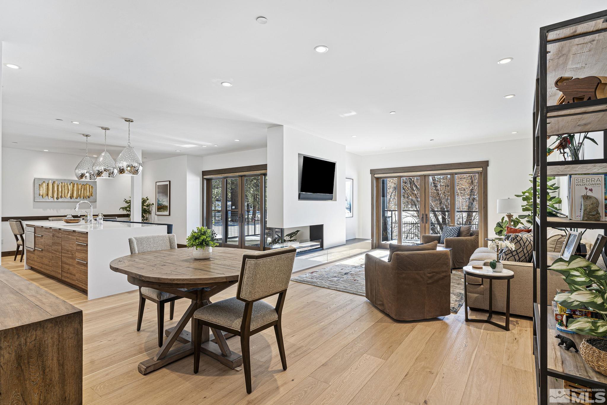 a dining room with furniture and wooden floor