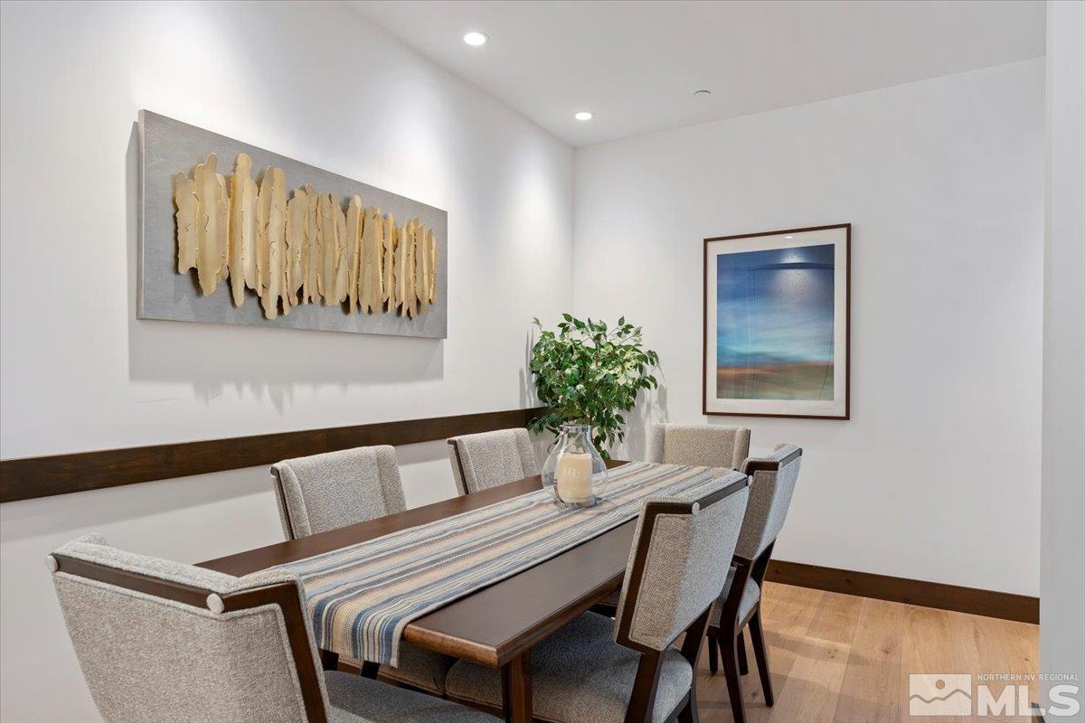 9 Beach Club Drive, Unit 111 Stateline, NV 89449 - Photo 11 of 40 a view of a dining room with furniture and a potted plant