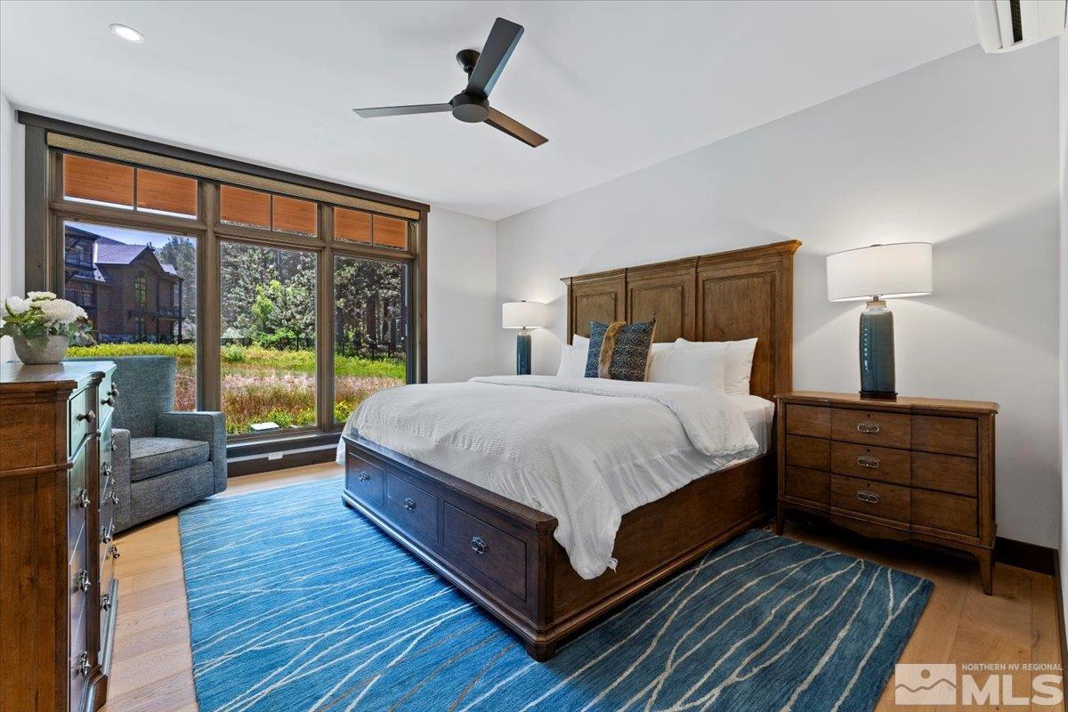 9 Beach Club Drive, Unit 111 Stateline, NV 89449 - Photo 12 of 40 a bed room with a bed and a large window