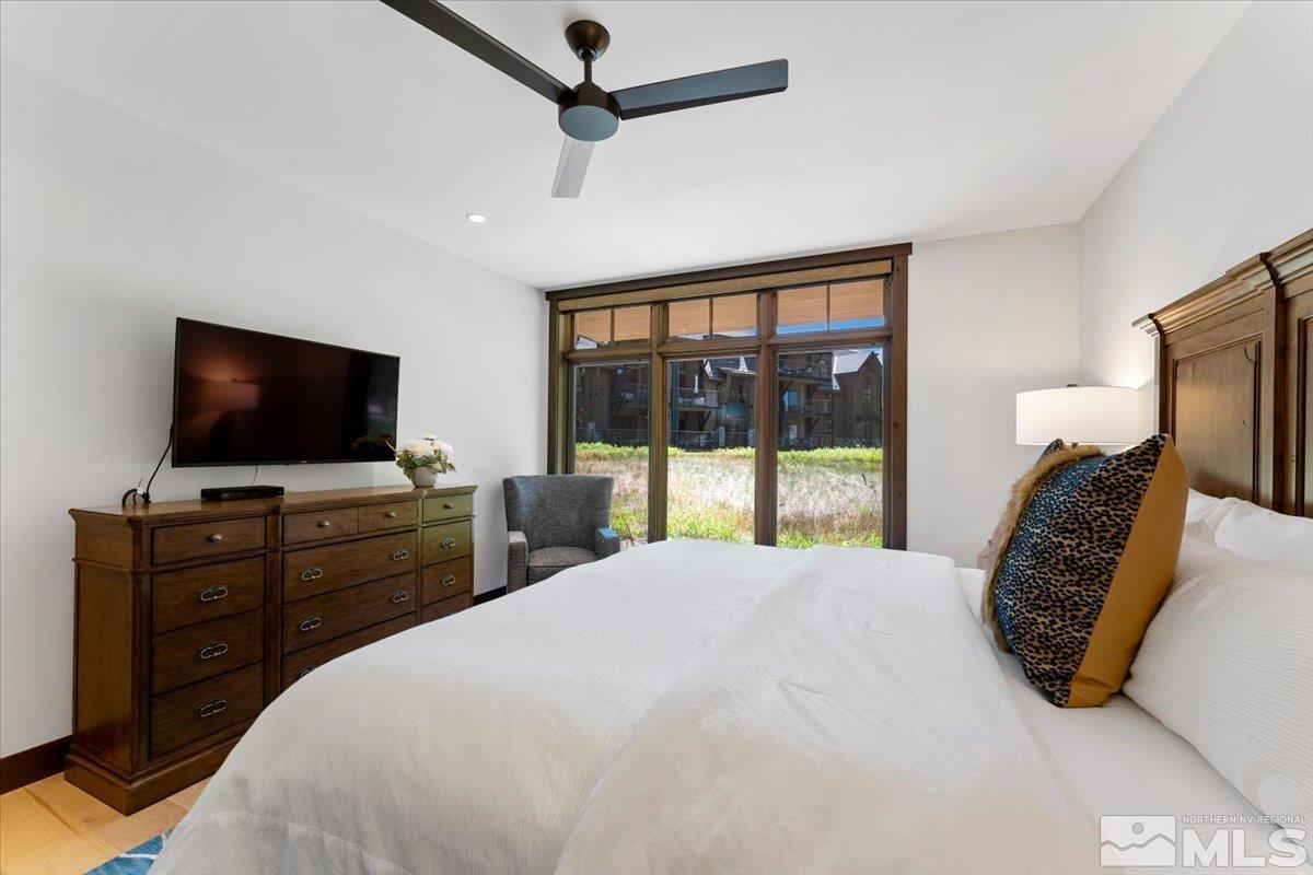 9 Beach Club Drive, Unit 111 Stateline, NV 89449 - Photo 13 of 40 a bedroom with a bed and a flat screen tv