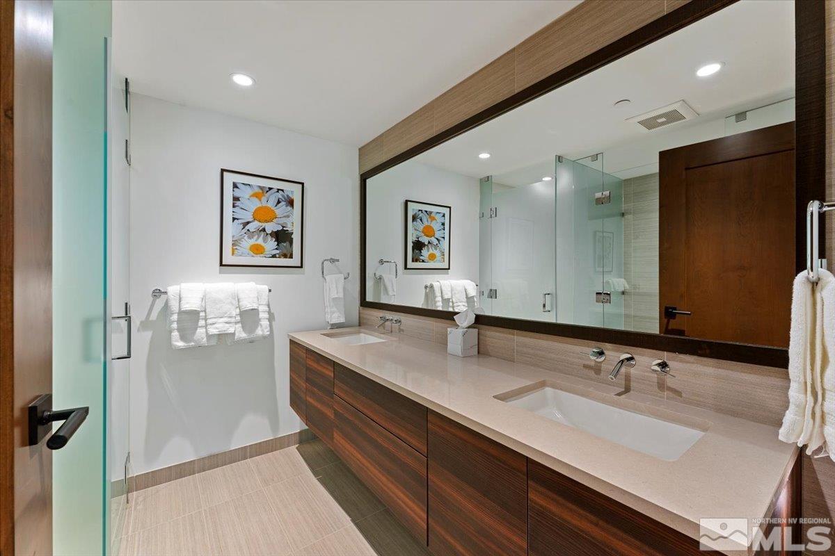 9 Beach Club Drive, Unit 111 Stateline, NV 89449 - Photo 14 of 40 a bathroom with a sink double vanity and a mirror