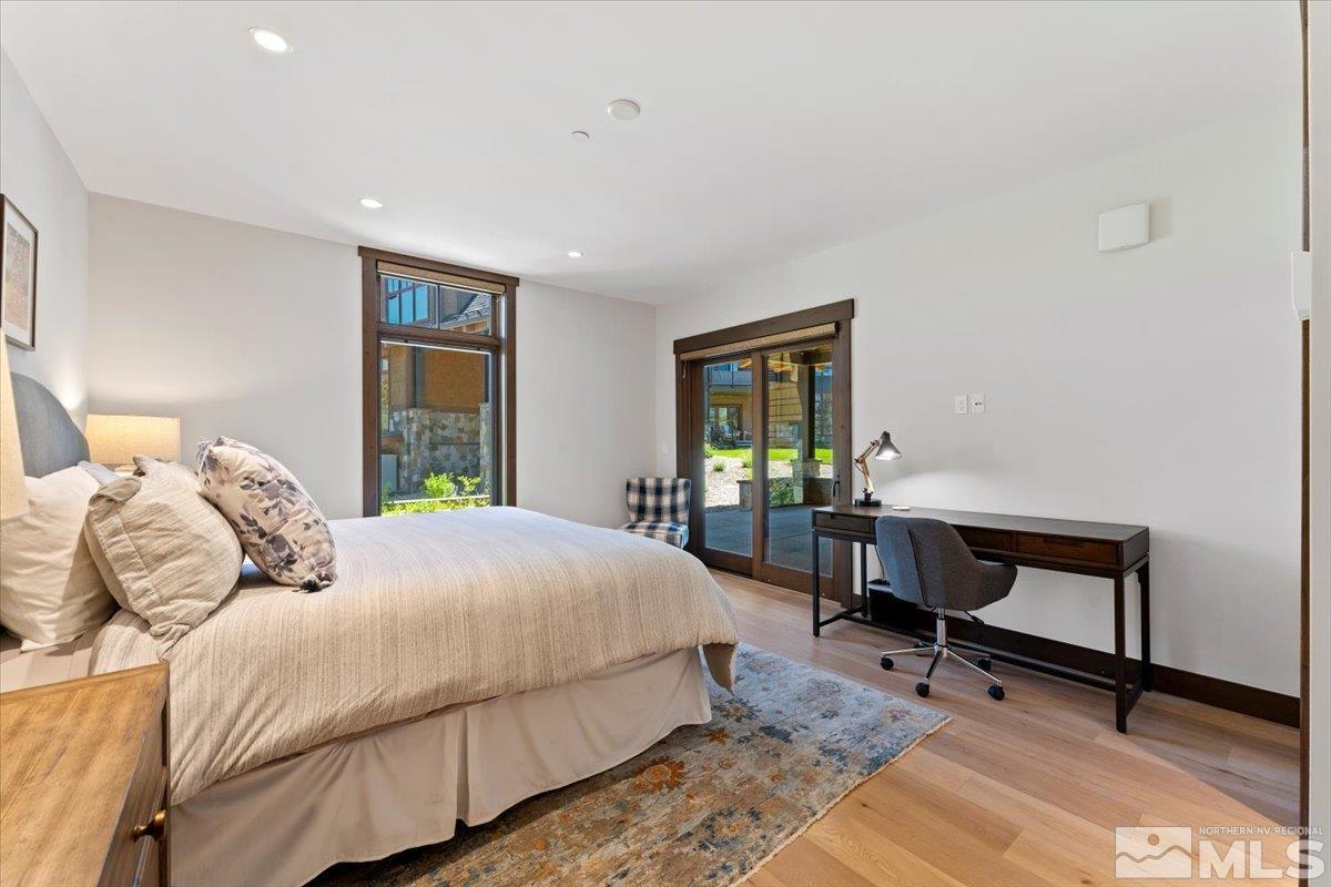 9 Beach Club Drive, Unit 111 Stateline, NV 89449 - Photo 15 of 40 a bedroom with a bed a table and a window