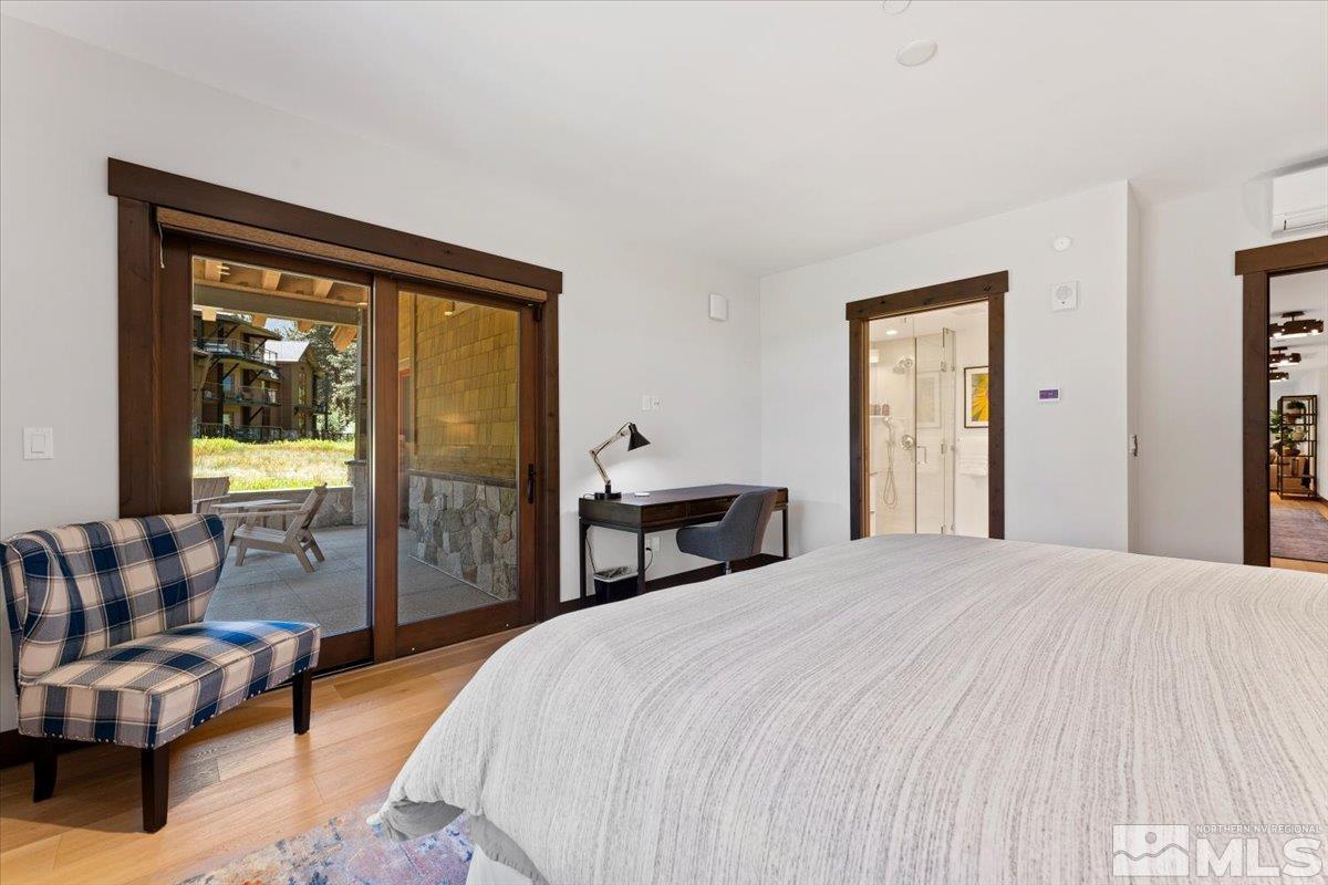 9 Beach Club Drive, Unit 111 Stateline, NV 89449 - Photo 16 of 40 a bedroom with a bed and a couch