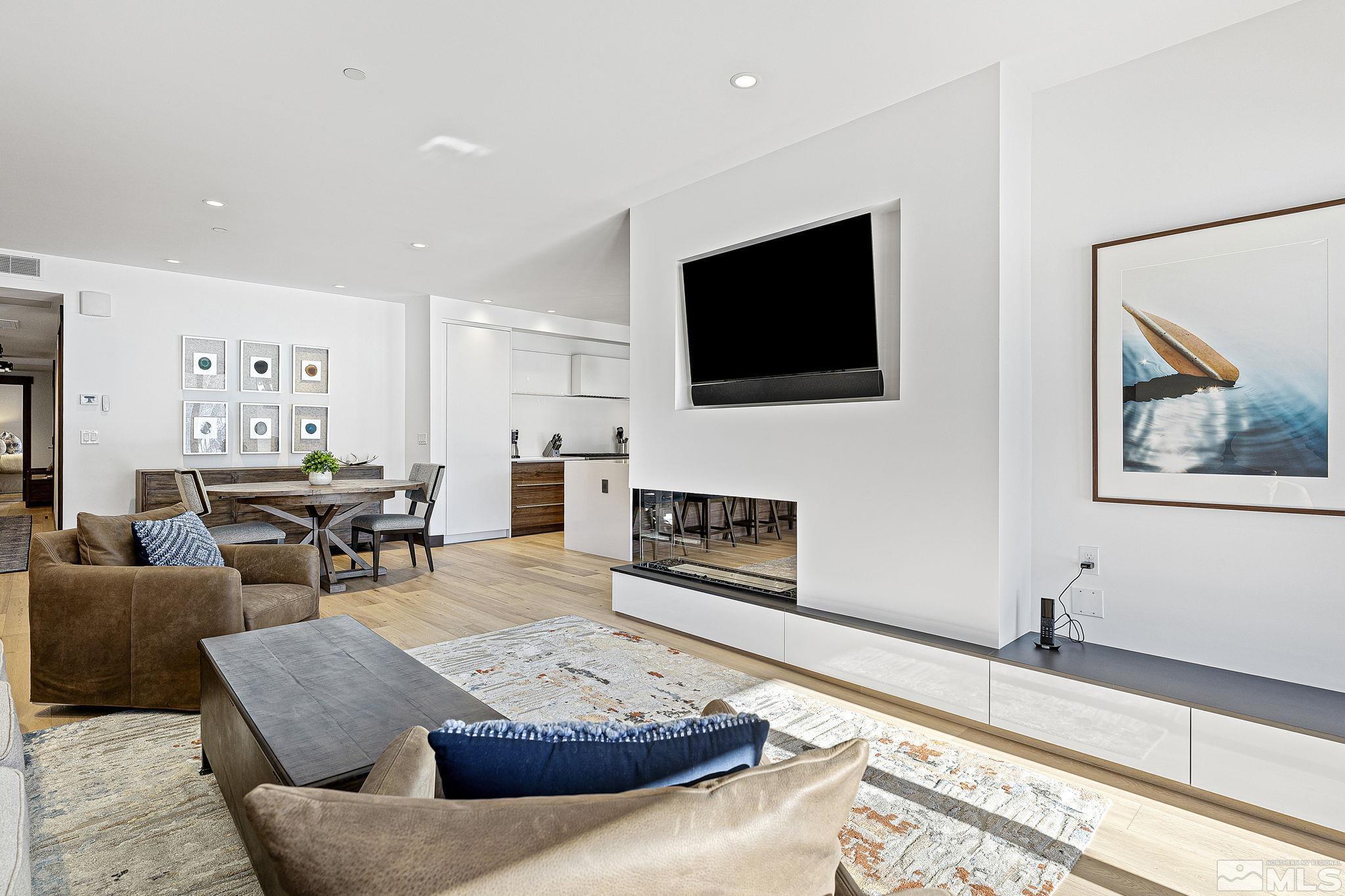 9 Beach Club Drive, Unit 111 Stateline, NV 89449 - Photo 4 of 40 a living room with furniture and a flat screen tv
