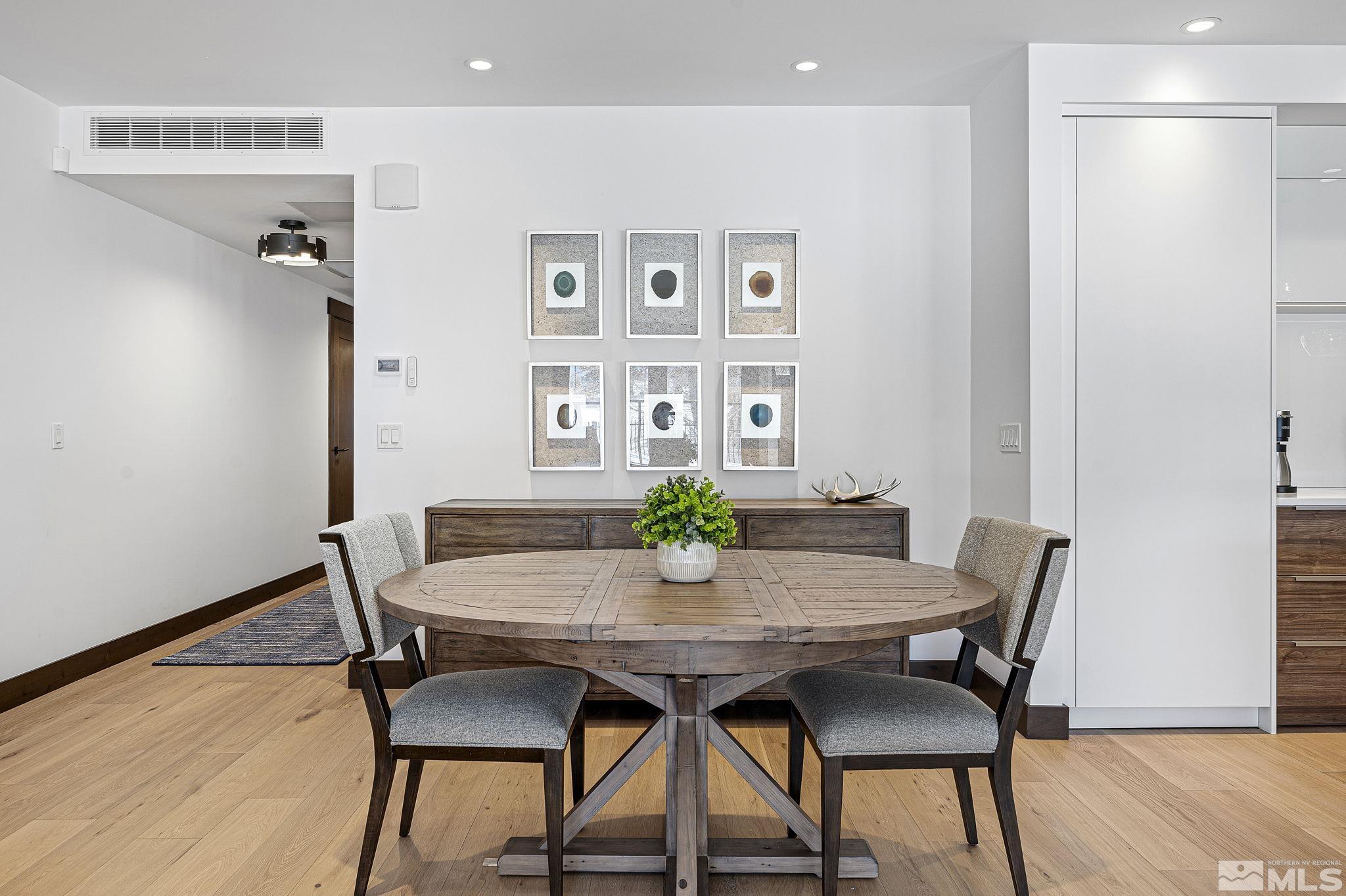 9 Beach Club Drive, Unit 111 Stateline, NV 89449 - Photo 6 of 40 a view of a dining room with furniture and wooden floor
