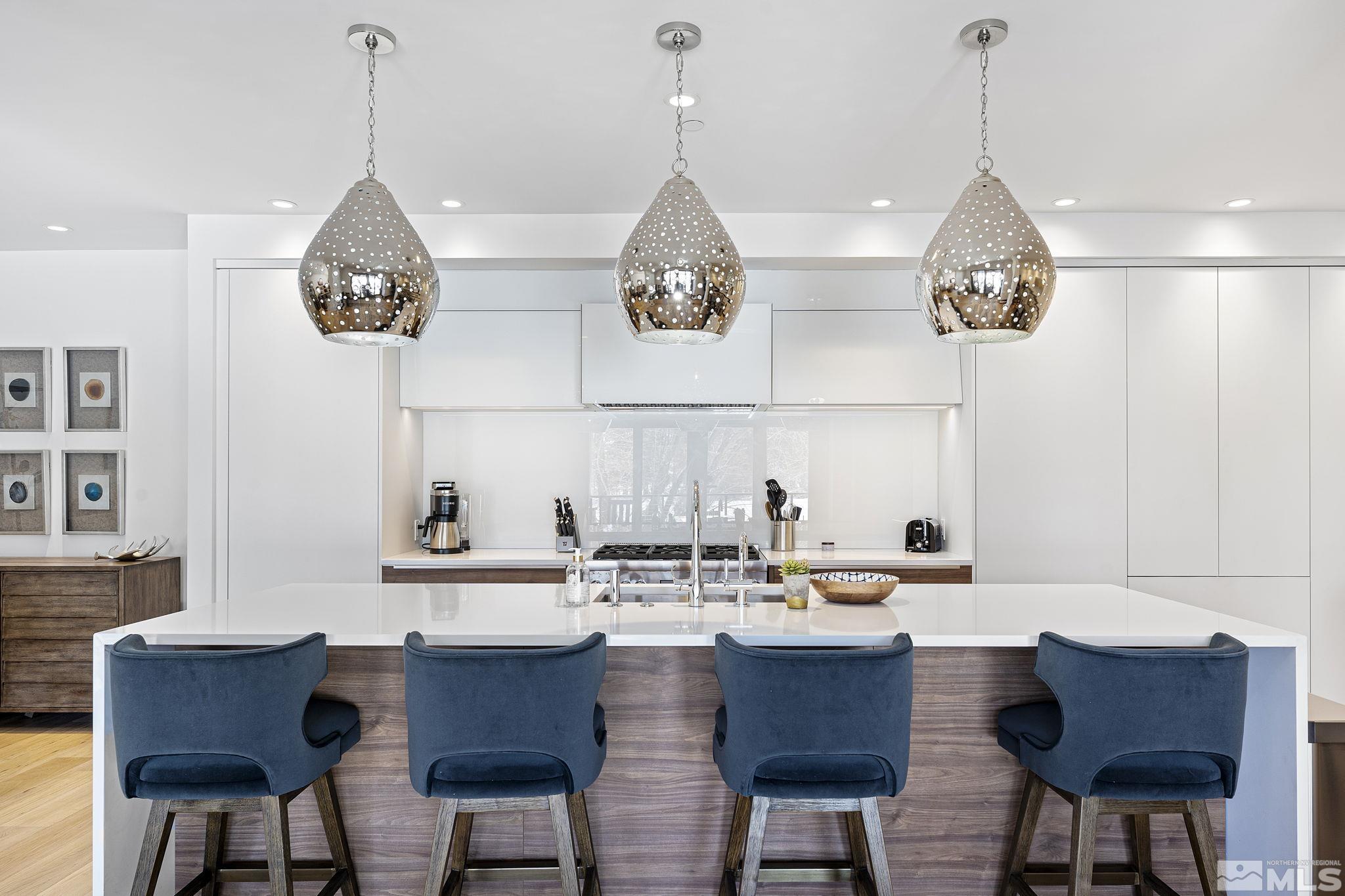 9 Beach Club Drive, Unit 111 Stateline, NV 89449 - Photo 7 of 40 a dining table chairs and a chandelier