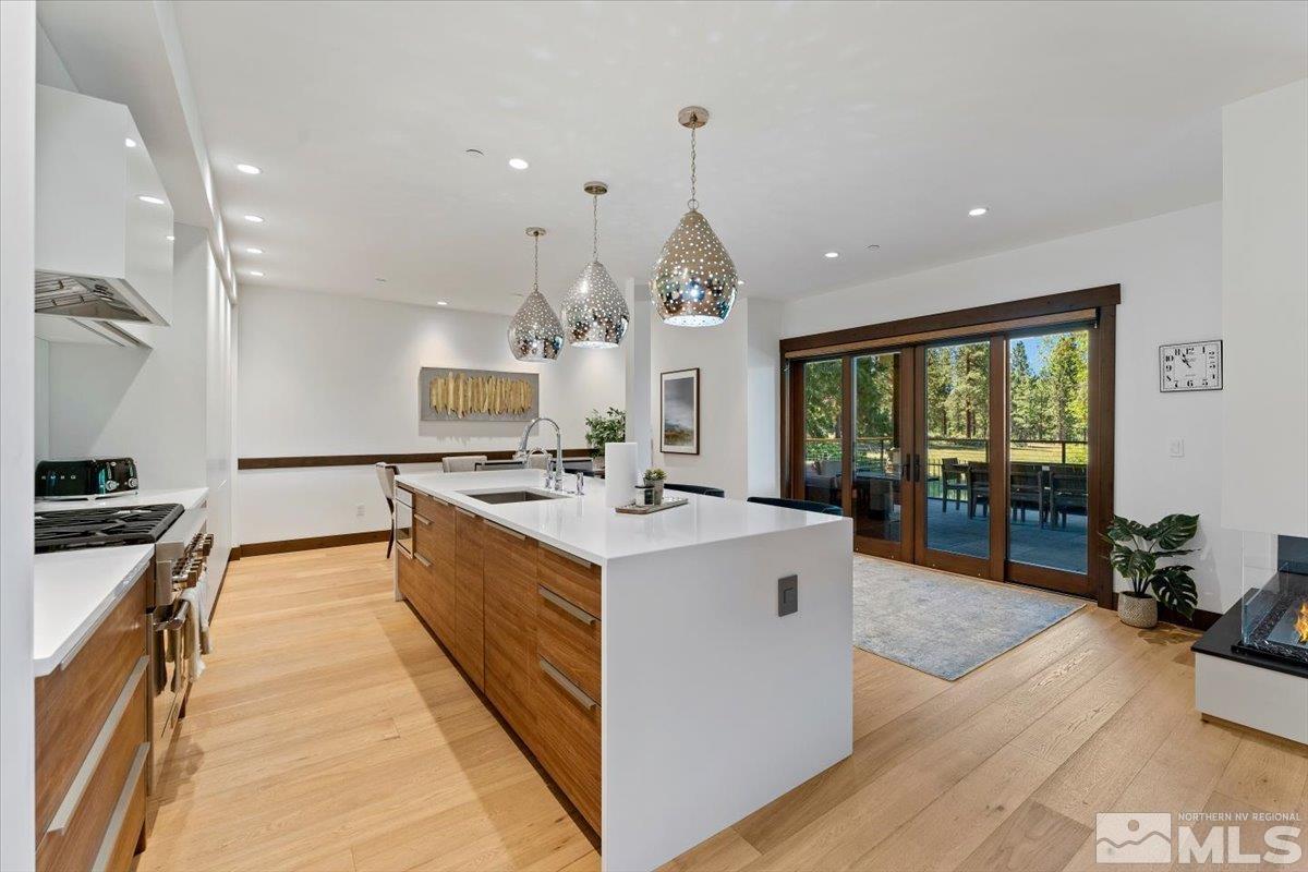 9 Beach Club Drive, Unit 111 Stateline, NV 89449 - Photo 8 of 40 a large kitchen with kitchen island a large counter space a sink and stainless steel appliances