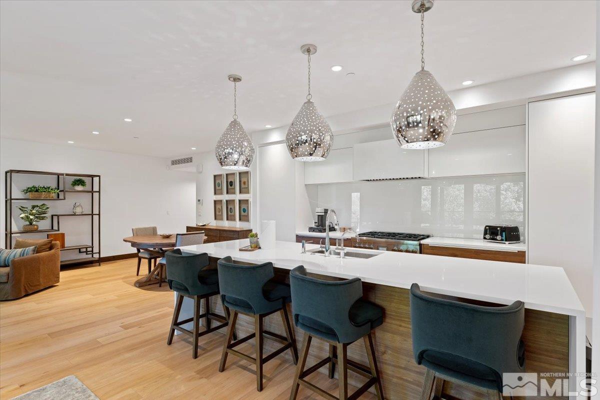 9 Beach Club Drive, Unit 111 Stateline, NV 89449 - Photo 10 of 40 a kitchen with a table and chairs in it