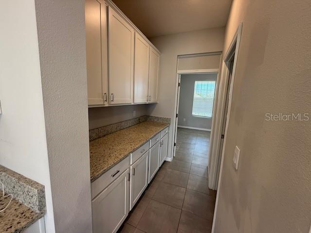 5644 Flagstone Trail Palmetto, FL 34221 - Photo 6 of 25 a bathroom with a granite countertop sink and washing machine