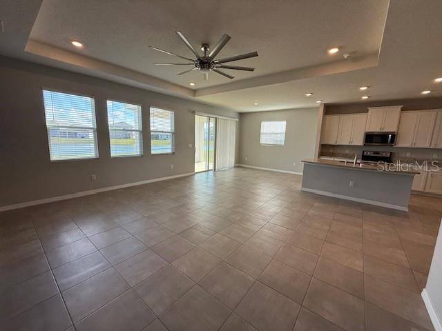 5644 Flagstone Trail Palmetto, FL 34221 - Photo 7 of 25 a view of a kitchen with a sink and a window