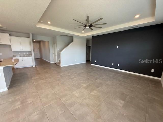5644 Flagstone Trail Palmetto, FL 34221 - Photo 8 of 25 an empty room with a ceiling fan and a window