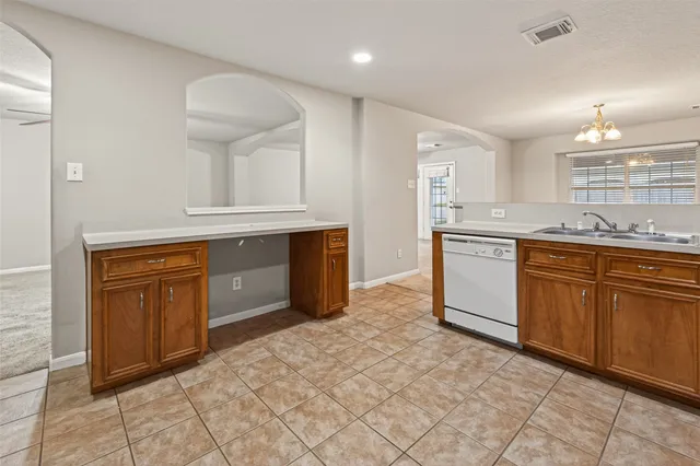 a kitchen with stainless steel appliances granite countertop a stove sink and cabinets