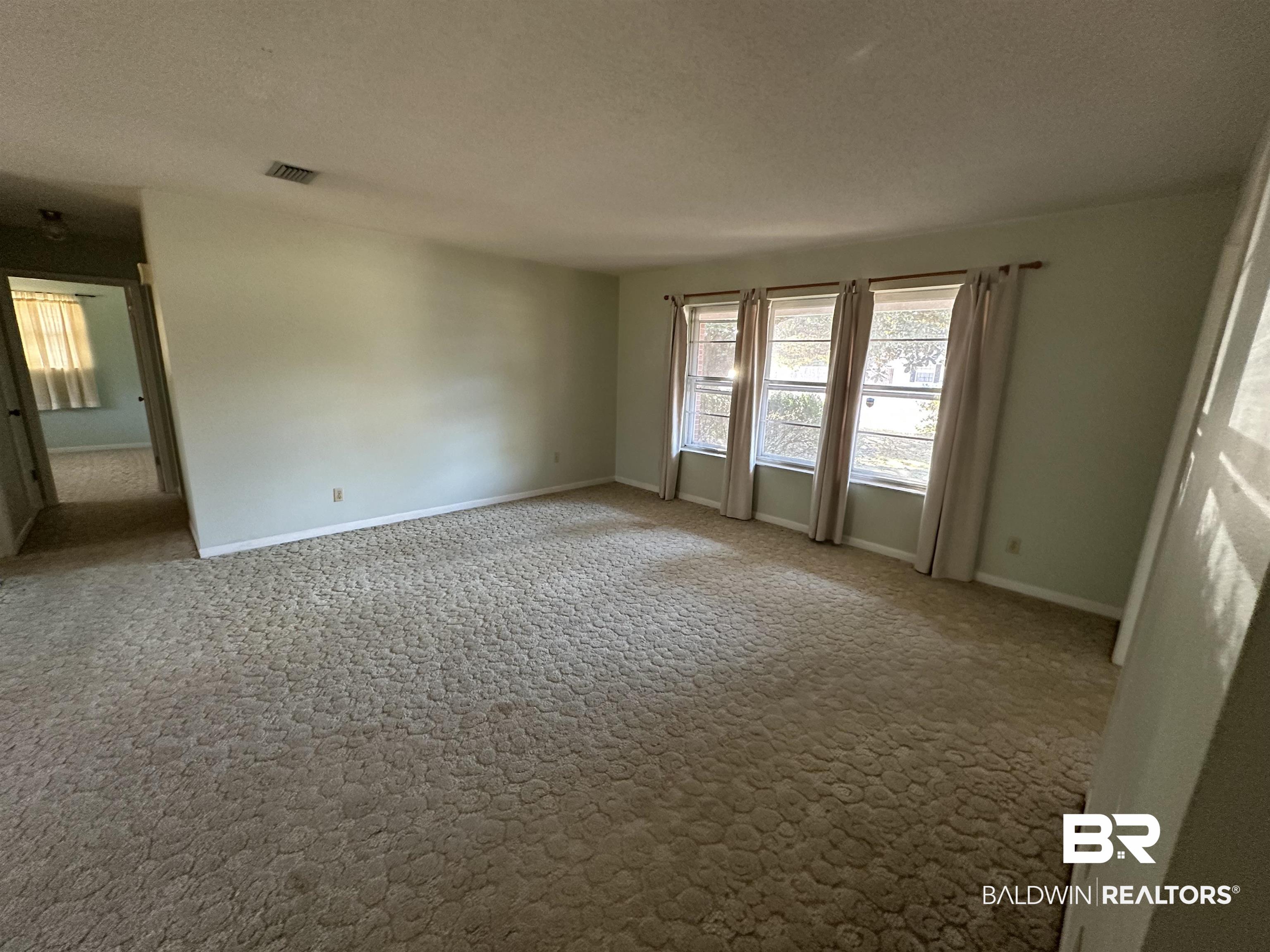 1 Yupon Circle Foley, AL 36535 - Photo 22 of 30 Unfurnished room featuring a textured ceiling and carpet flooring