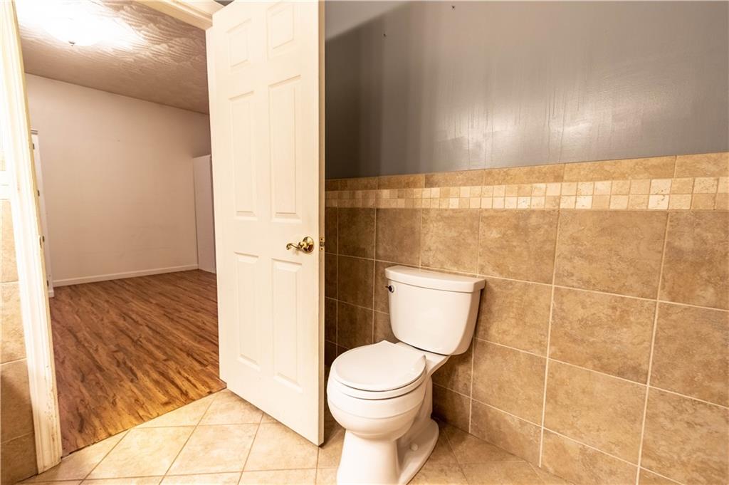210 Whitestown Road Butler, PA 16001 - Photo 15 of 21 a bathroom with a toilet and a shower