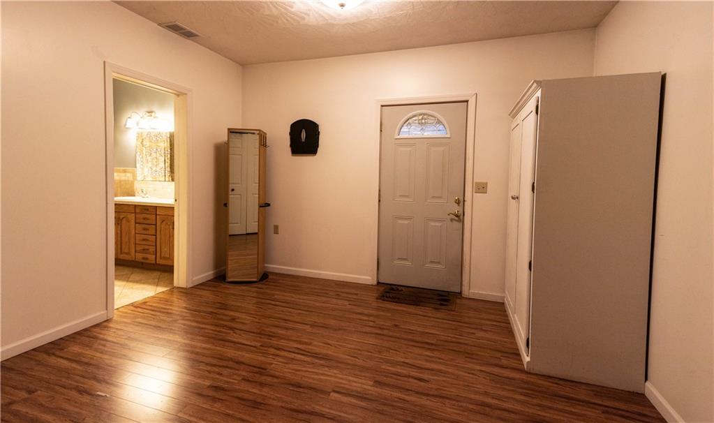 210 Whitestown Road Butler, PA 16001 - Photo 19 of 21 an empty room with wooden floor and closet area
