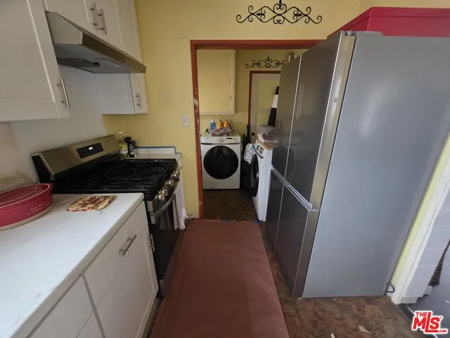 a patio with a table and chairs