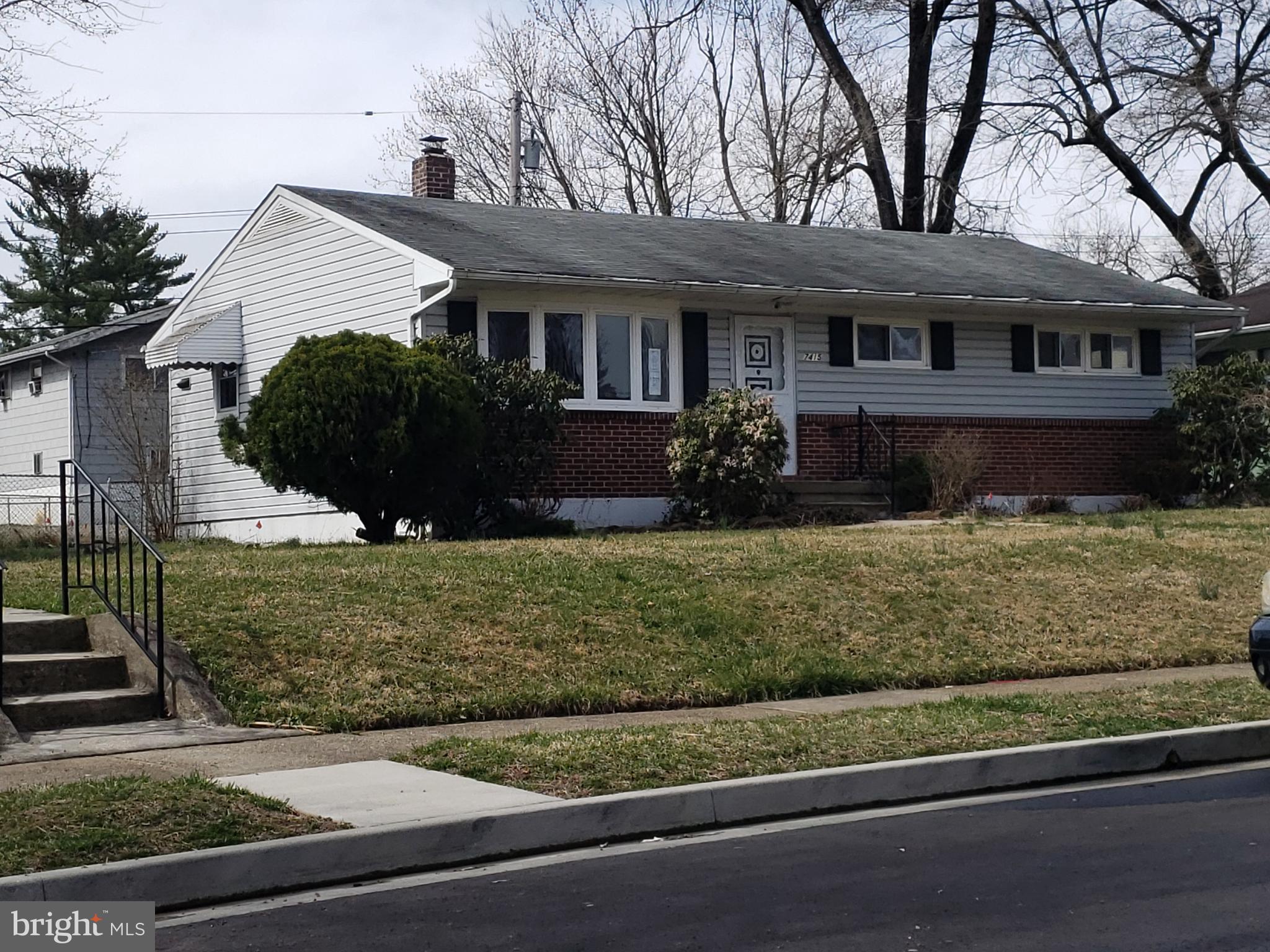 7415 Remoor Road Baltimore, MD 21207 - Photo 2 of 45 front view of a house with a yard
