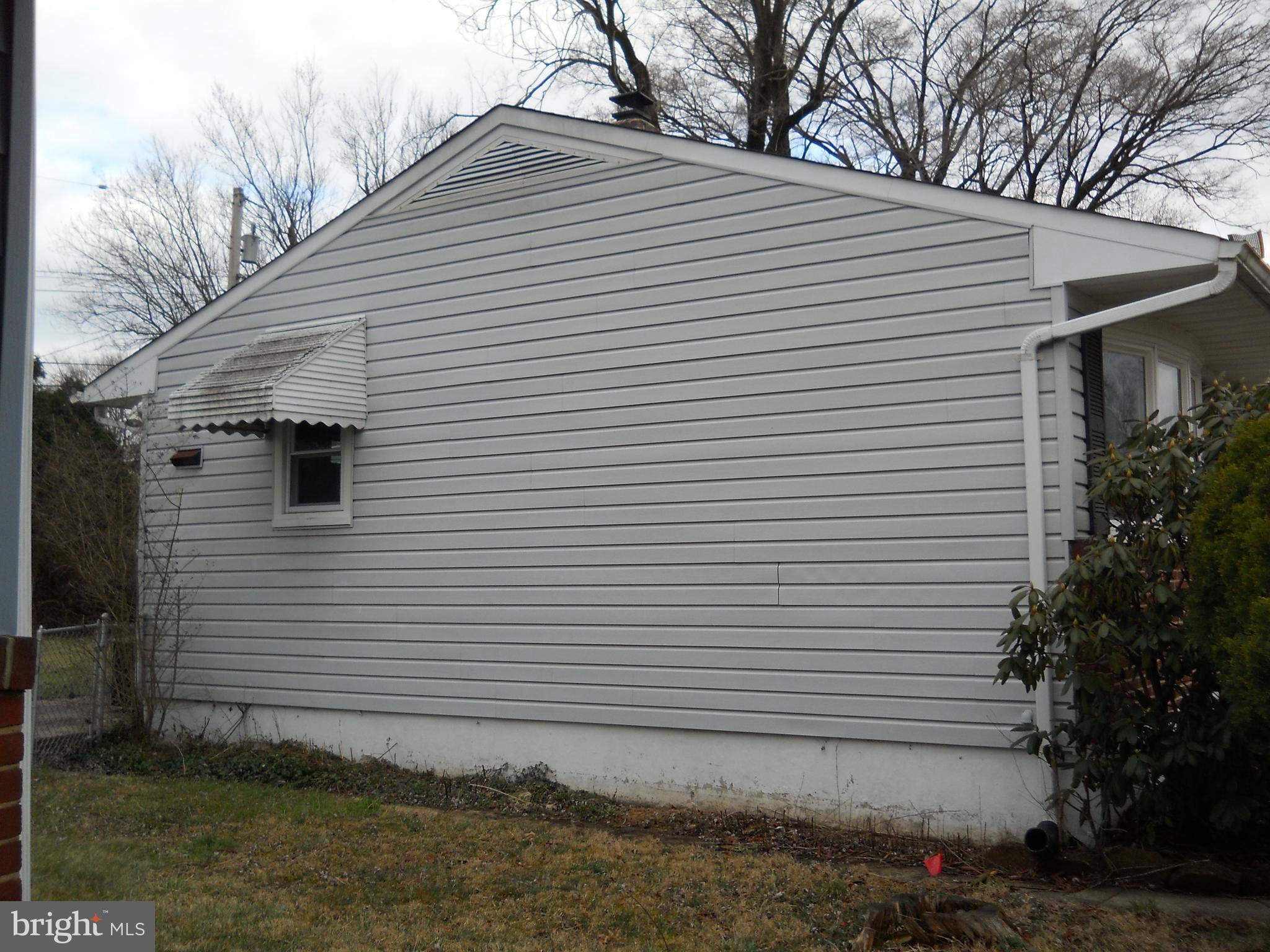 7415 Remoor Road Baltimore, MD 21207 - Photo 3 of 45 a view of a white house next to a yard
